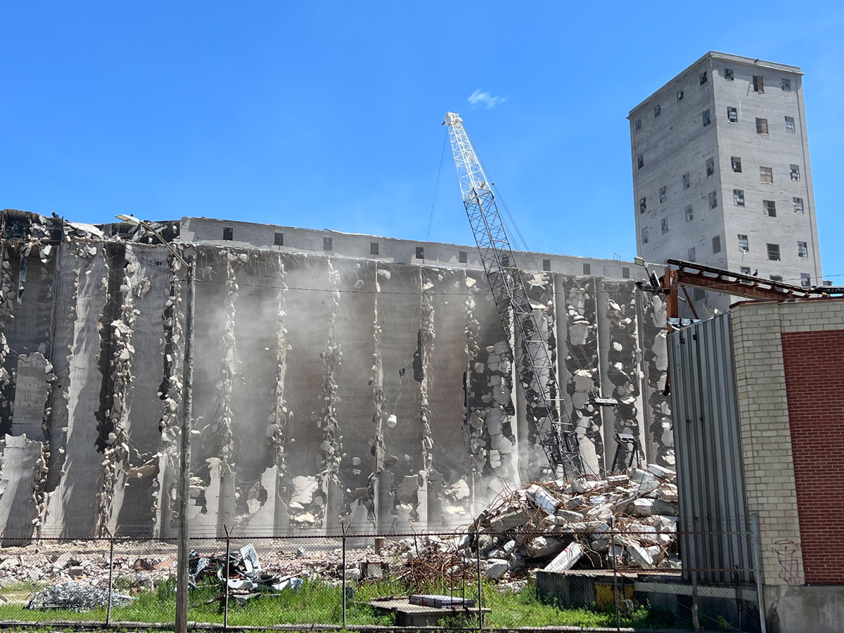 Pillsbury - progress toward full demolition - the 10,000 pound wrecking ball and crane on the north silos.