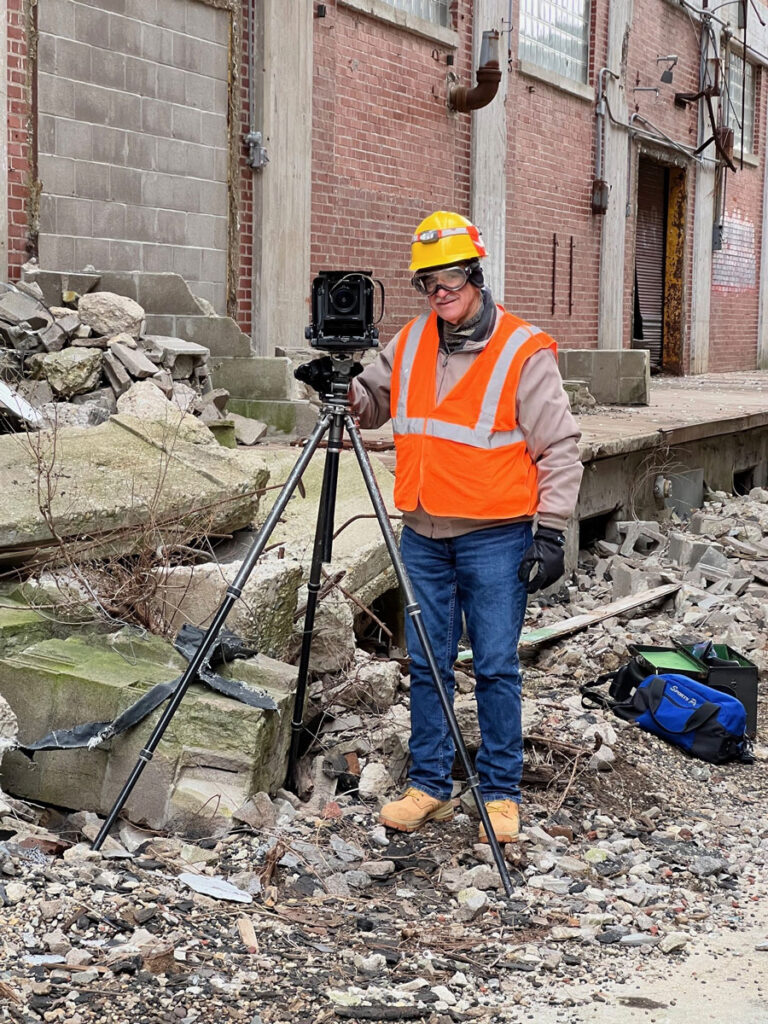 Ben Halpern, our archival photographer, in November of 2022, set to photograph the east wall of Warehouse #4 that was built in 1929. He captured the image just two months before the partially collapsed building was demolished.