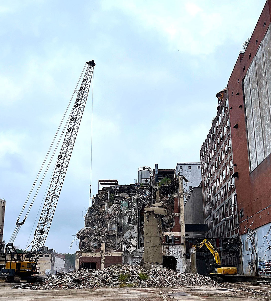 Demolition of the 96,000 square foot Grocery Mix Building at Pillsbury continues this week.